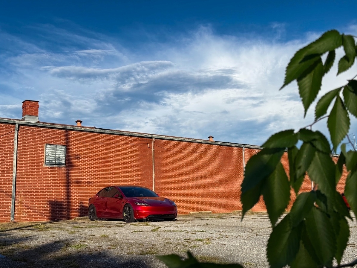 Model 3 lurking behind the old brick warehouse